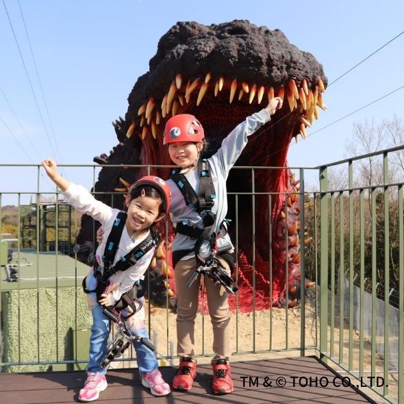 Children at the zipline at the Godzilla theme park in Nijigen no Mori on Awaji Island, Japan