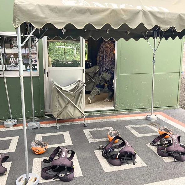 The harness station at the Godzilla zipline at Nijigen no Mori