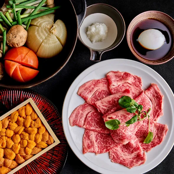 awaji beef sankai tomato sukiyaki with slices of raw awaji beef and local vegetables