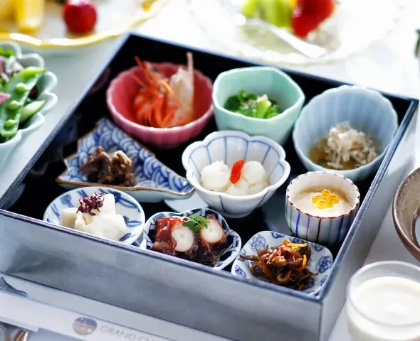 Traditional Japanese breakfast with Awaji Island ingredients, small dishes, grilled fish and dashimaki tamago at Grand Chariot
