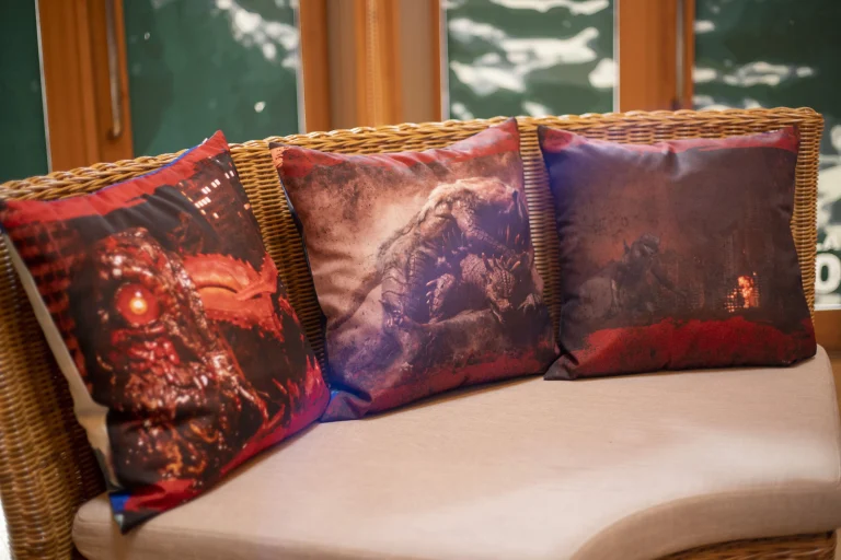 Three Godzilla pillows on the sofa at themed Godzilla room at GRAND CHARIOT Private Luxury Villas.