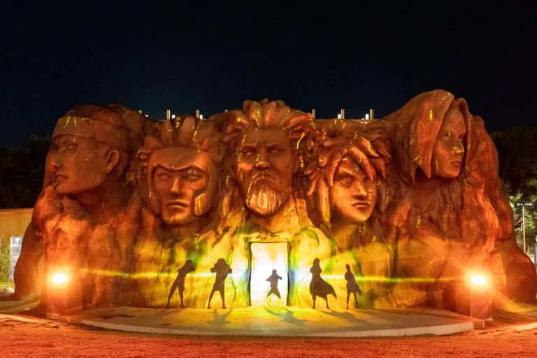 Naruto projection mapping show lighting up Hokage Rock at night in Nijigen no Mori Awaji Island