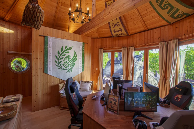 Monster Hunter themed gaming room with computers and table at Grand Chariot Awaji Island cocoon villa