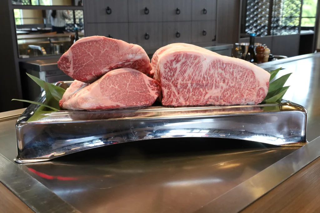 Thick cuts of high-quality wagyu beef ready for grilling at Aman no Shokutaku Sajiki on Awaji Island.